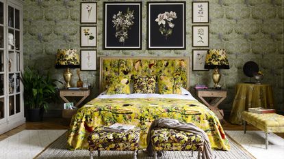 Yellow maximalist bedroom with chinoiserie moss green wallpaper and floral bedding by Mindthegap
