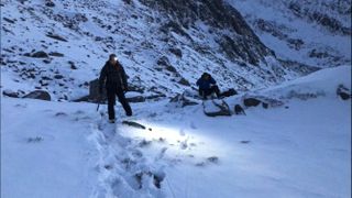 what is an epic in climbing and mountaineering: headlamps on