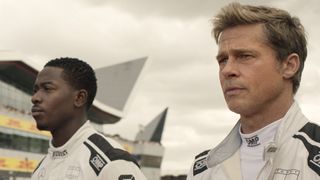 Damson Idris as Joshua Pearce and Brad Pitt as Sonny Hayes in Apple Original Films’ “F1 The Movie,” now in theaters and IMAX.