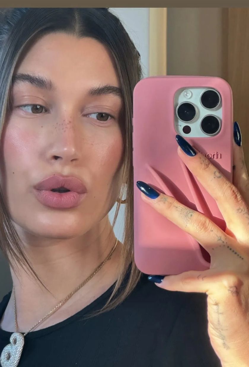 Hailey Bieber wearing OPI Midnight Mantra nail polish