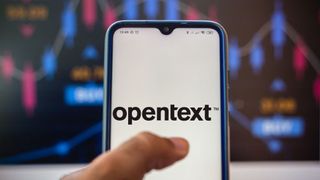The OpenText logo shown on a phone, with a colourful wall in the background