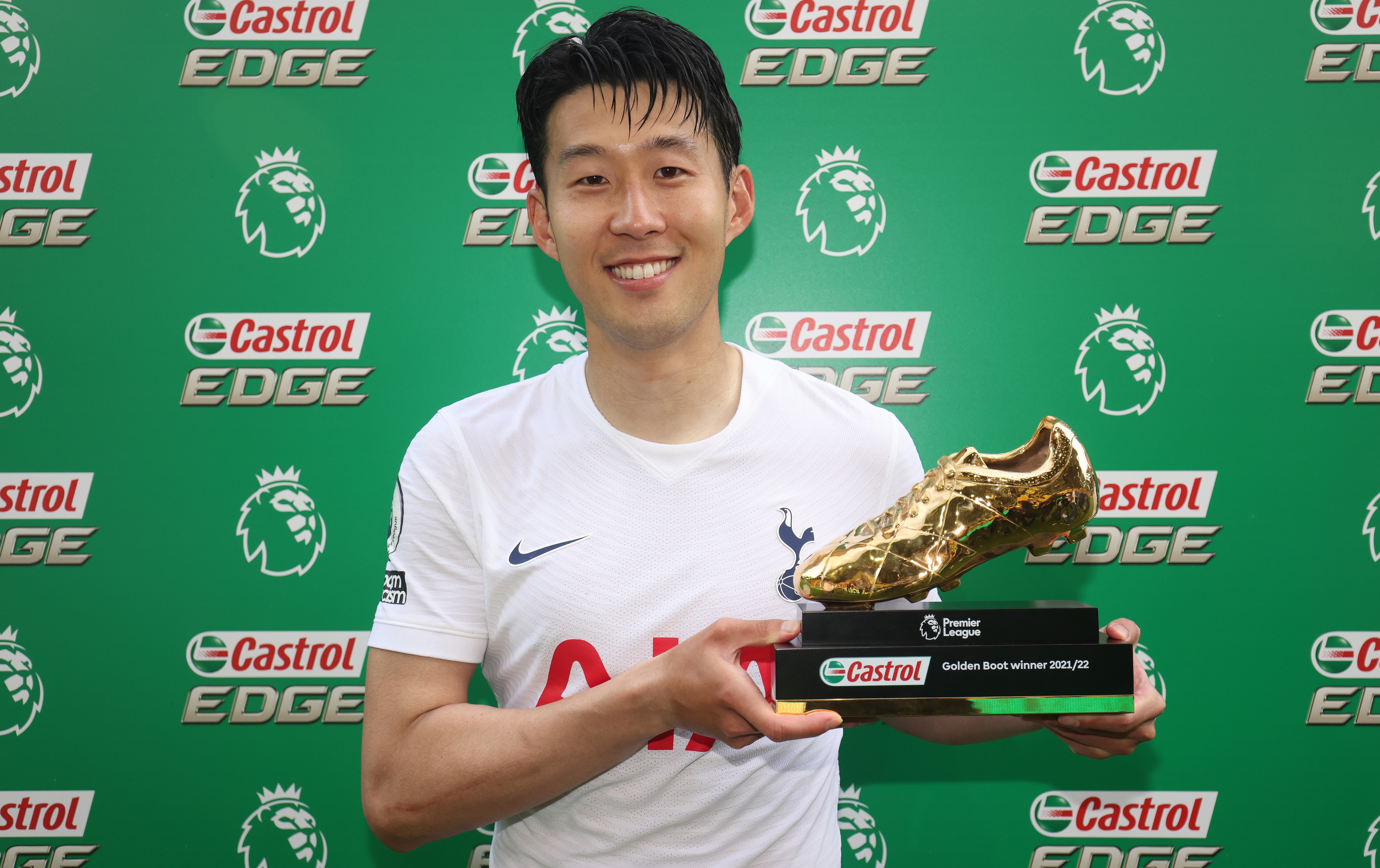Tottenham forward Son Heung-min holding the 2021/22 Premier League Golden Boot trophy
