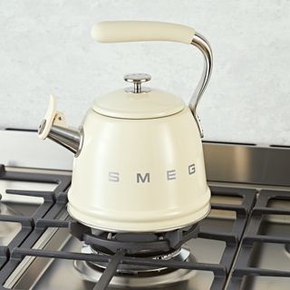 White SMEG tea kettle on a stovetop