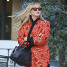 Jennifer Lawrence looks stylish in a red and black outfit while out for dinner with friends in bustling New York.