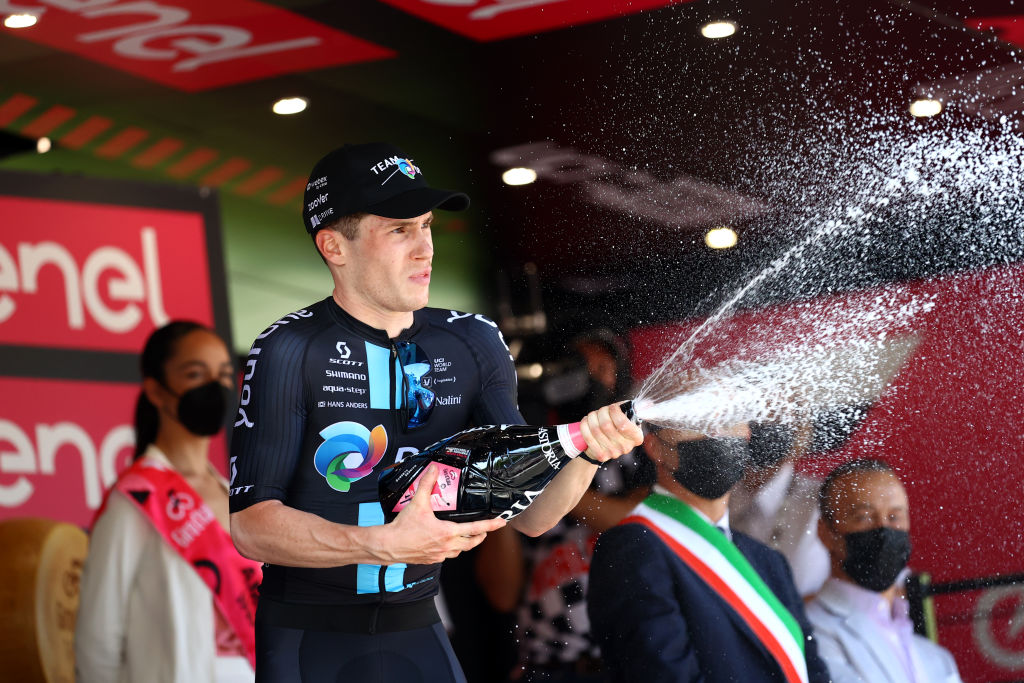 REGGIO EMILIA ITALY MAY 18 Alberto Dainese of Italy and Team DSM celebrates at podium as stage winner during the 105th Giro dItalia 2022 Stage 11 a 203km stage from Santarcangelo di Romagna to Reggio Emilia Giro WorldTour on May 18 2022 in Reggio Emilia Italy Photo by Michael SteeleGetty Images