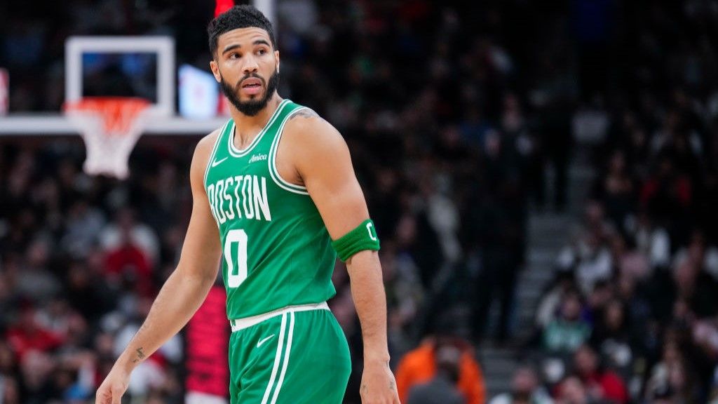 NBA star Jayson Tatum walking across the basketball court