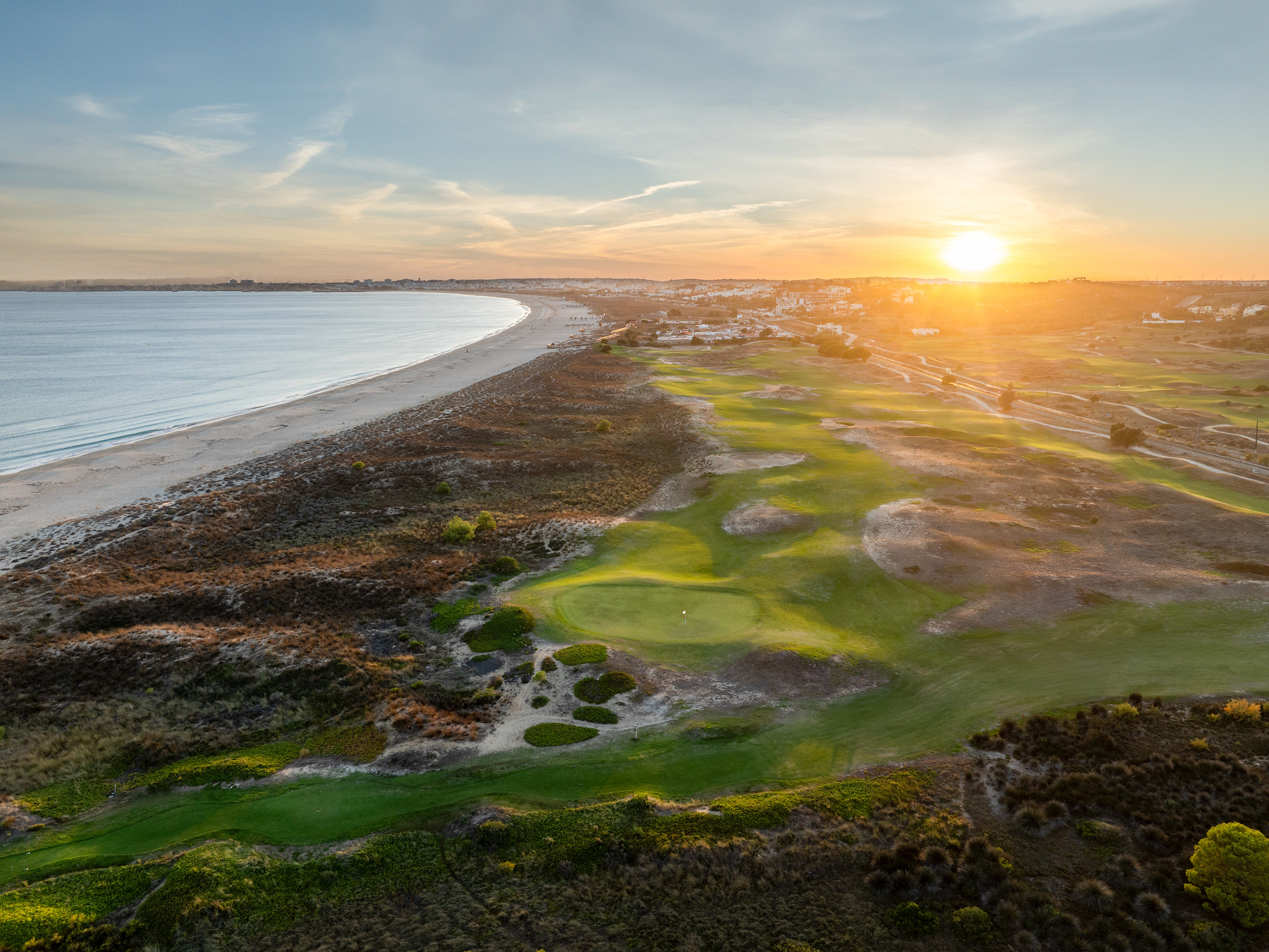 A hole on the Palmares Praia course at sunset