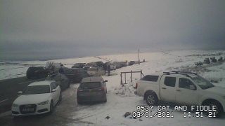 Webcam image of cars in snow