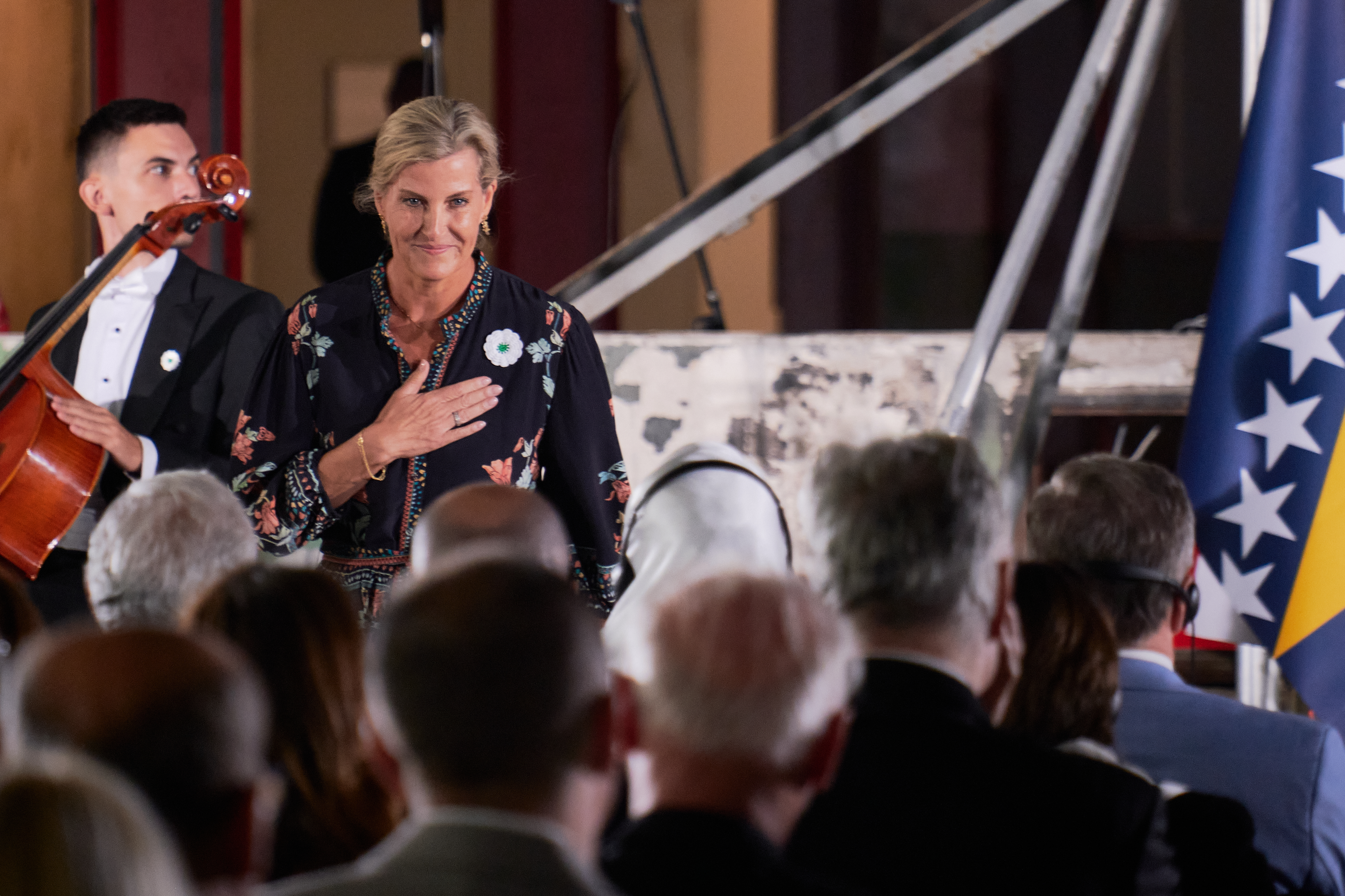 Duchess Sophie wearing a black dress putting her hand on her heart during a Bosnian memorial