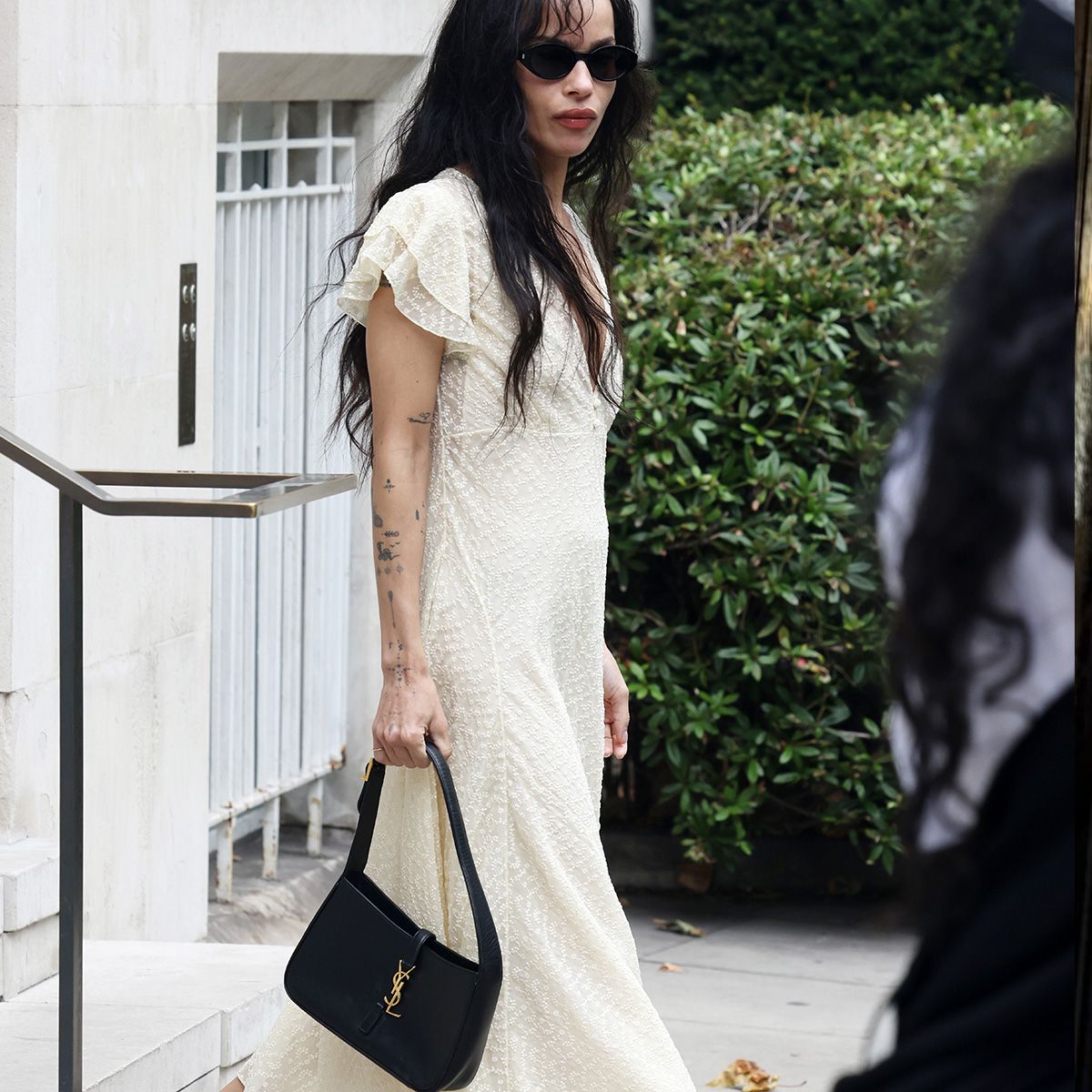 zoe kravitz holding a saint laurent bag