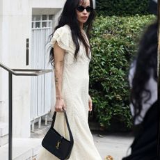 zoe kravitz holding a saint laurent bag