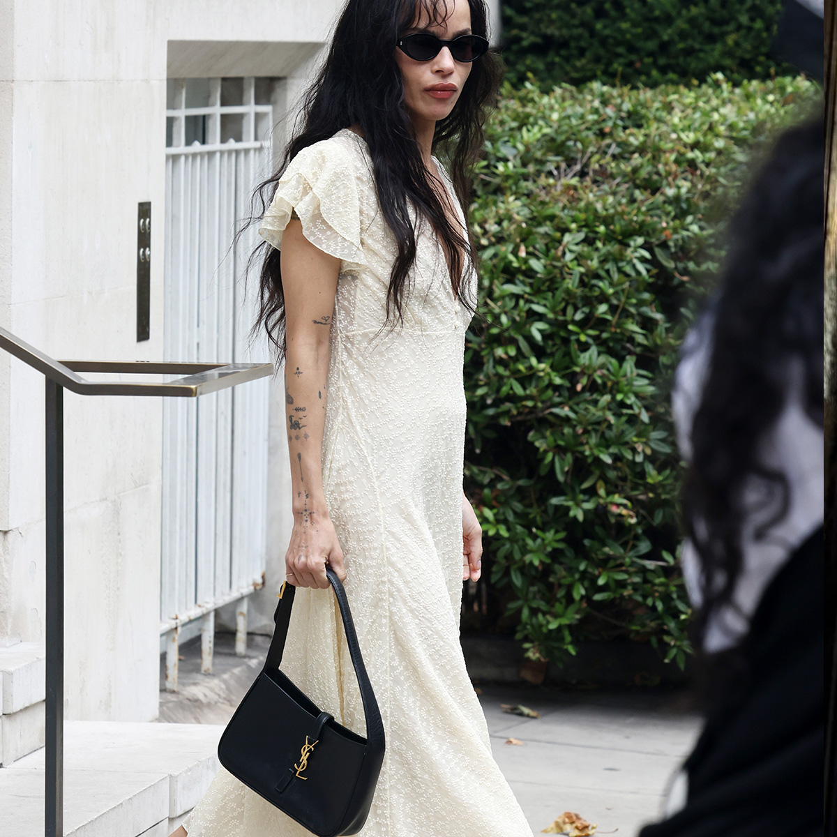 zoe kravitz holding a saint laurent bag