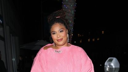 Lizzo in a pink sweater dress 