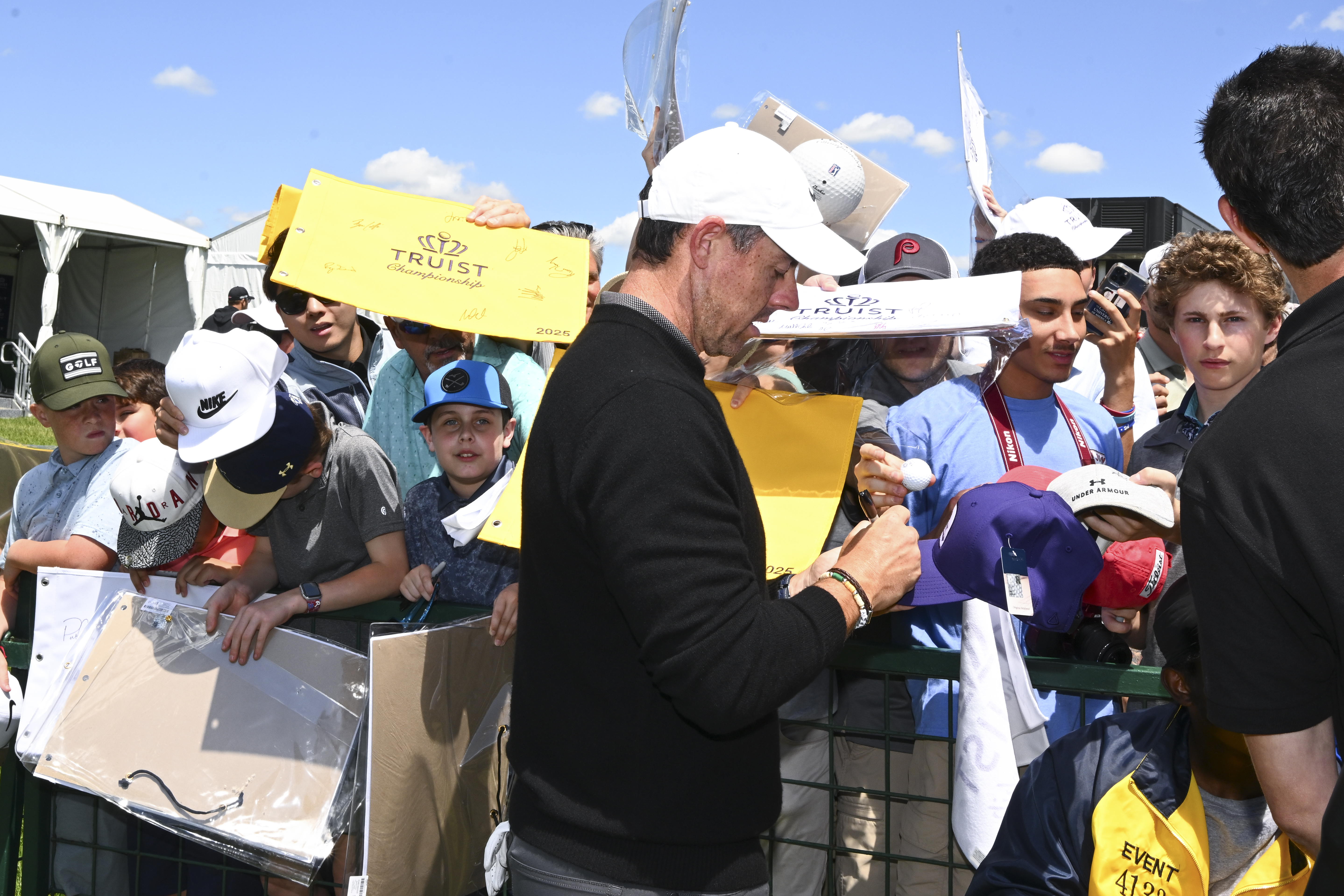 Rory McIlroy signs autographs for fans