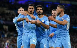 Joao Cancelo (second left) celebrates with his Manchester City team-mates after scoring the fifth goal