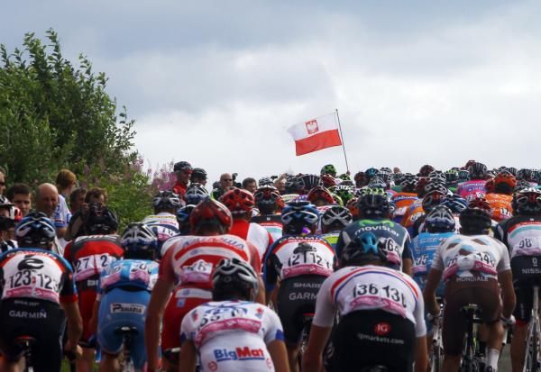 The Polish flag flies over the peloton