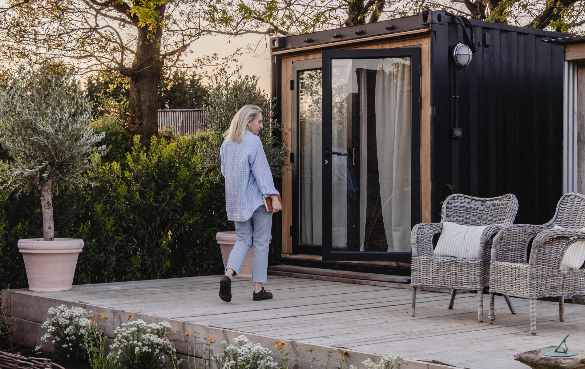 Couple converts shipping container into creative garden office