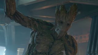 Groot stands smiling in a ship's doorway in Guardians of the Galaxy.