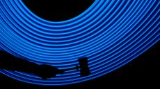 Hand with a judge's gavel with in a futuristic background