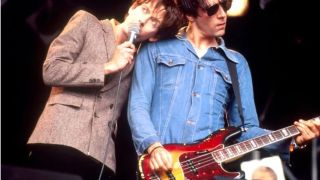 Jarvis Cocker and Liam Gallagher share the stage at Glastonbury in 1995
