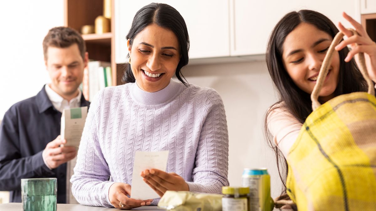 people in a kitchen with an insulation advisor