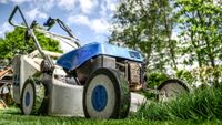 Image of lawn mower on grass