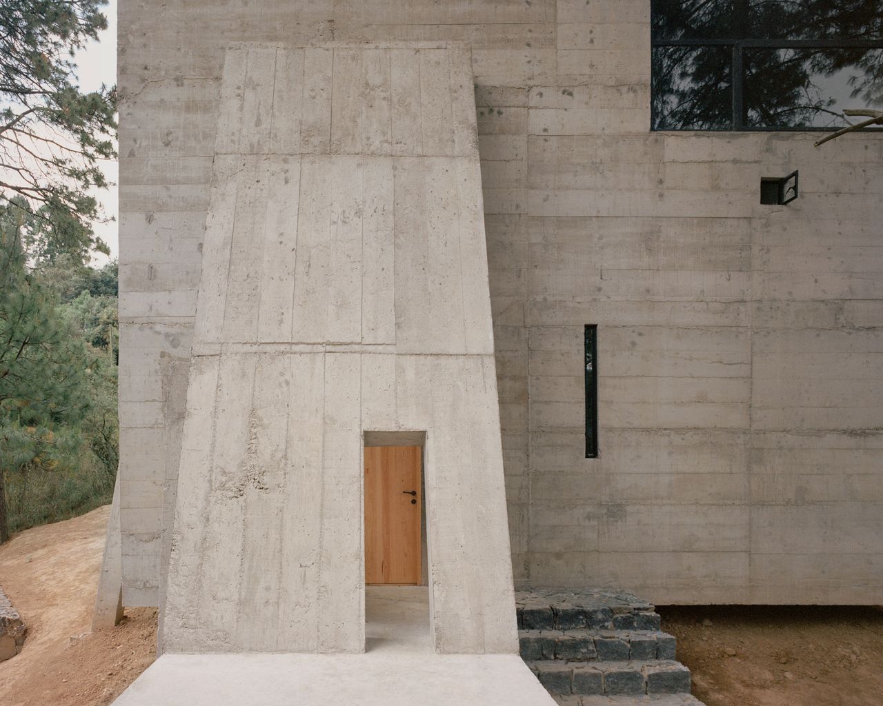 entrance to the brutalist casa alferez, by Ludwig Godefroy