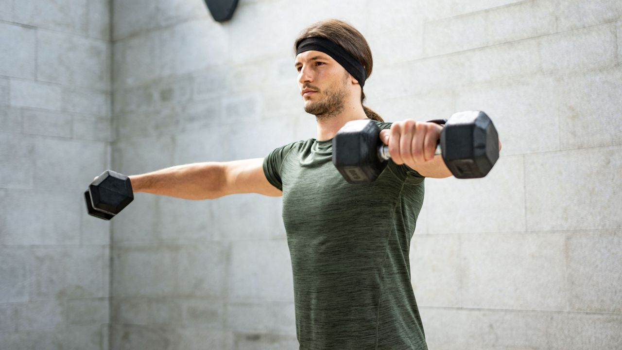 Man exercising with dumbbells