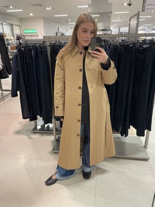 Woman wears M&S beige trench coat