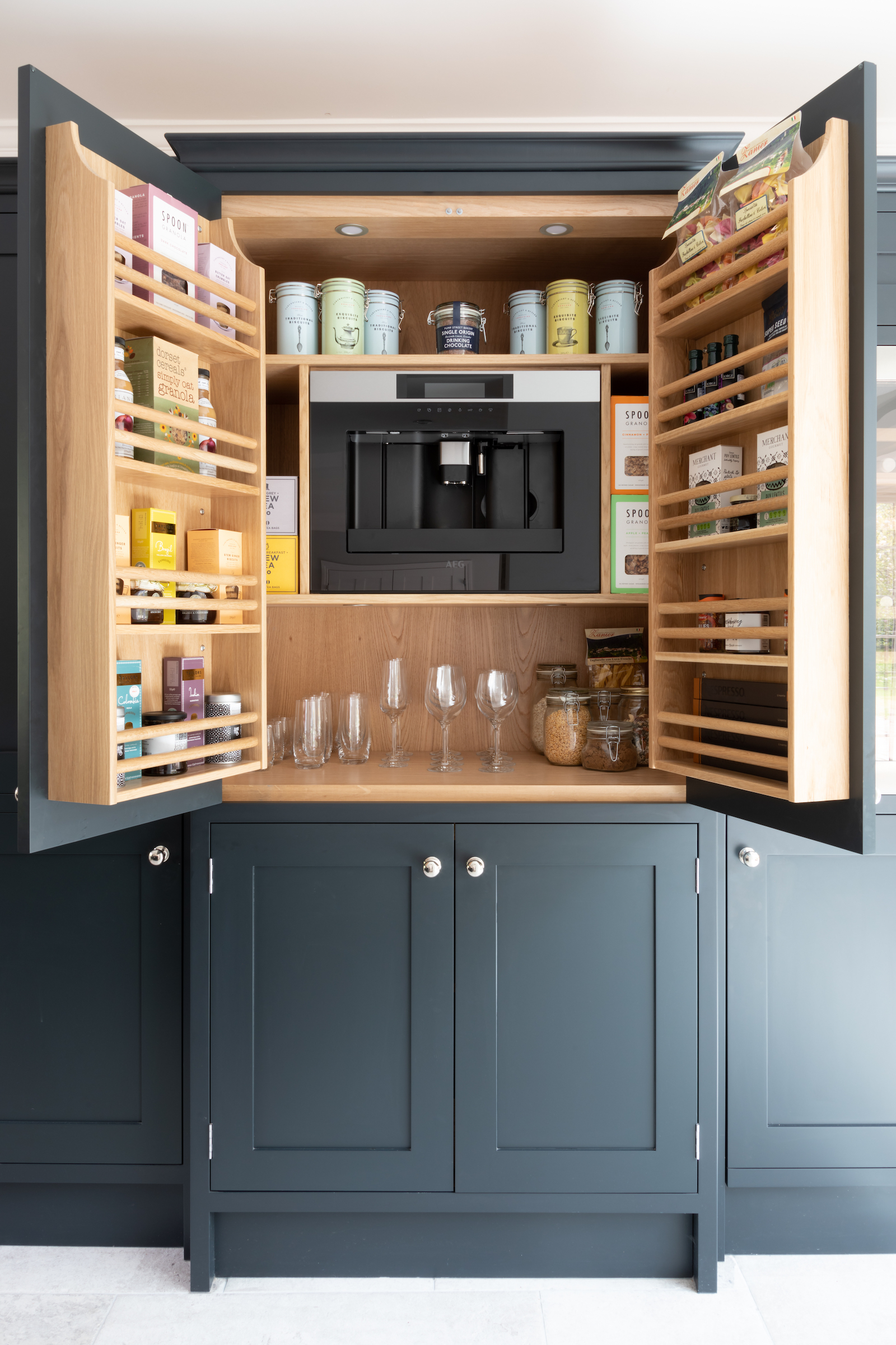 Shaker kitchen with black and white cabinetry and quartz countertops