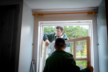 men installing new windows