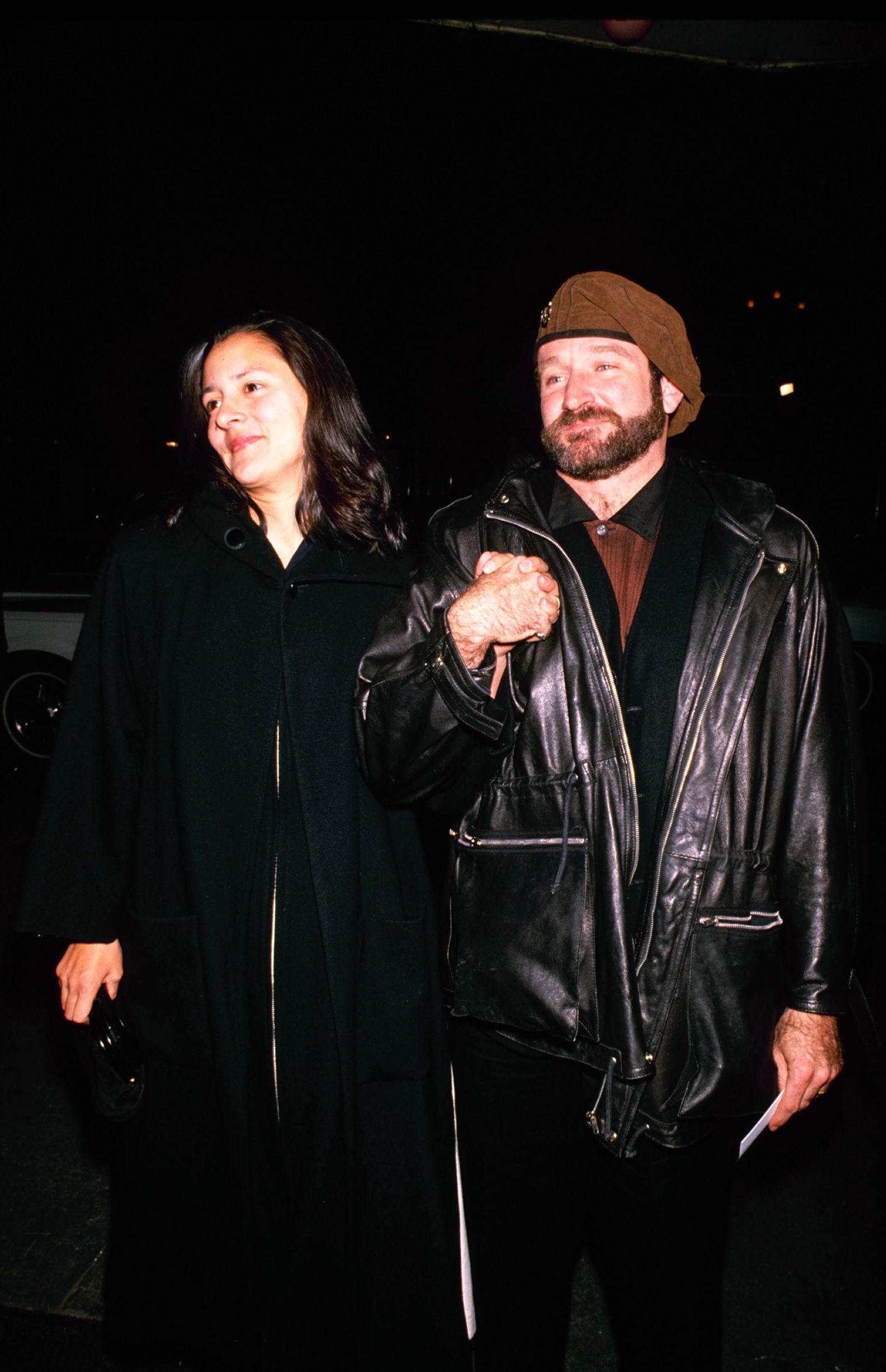 Robin Williams wearing a leather jacket.