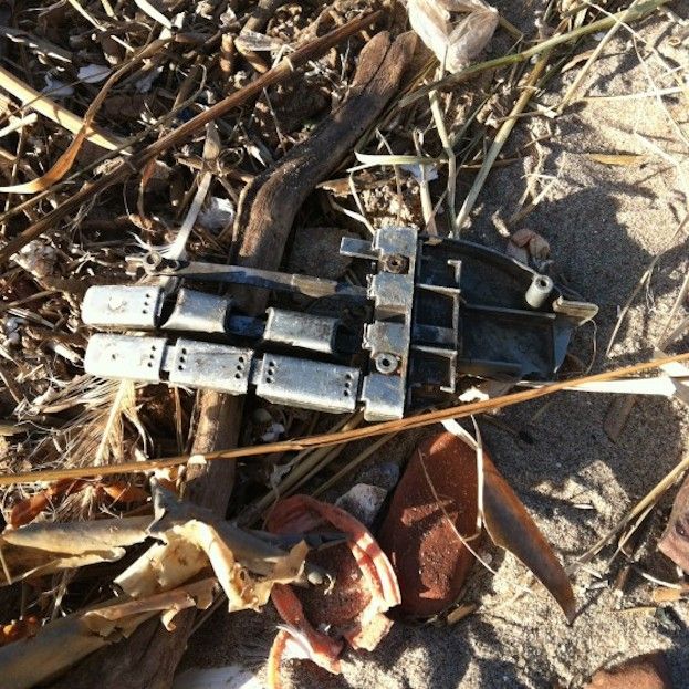 Robot hand on beach