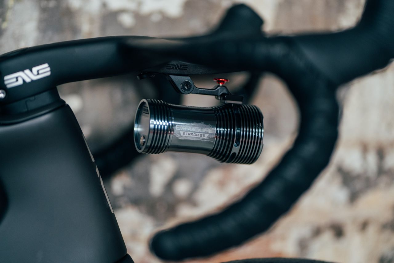 The Exposure Strada 13 SB attached to the bars of a road bike