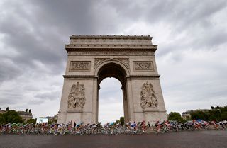The Tour de France passes the Arc de Triomphe on the Champs-Élysées