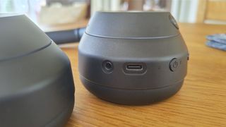 Sony ULT Wear over-ear headphones close up on earcup connections and controls