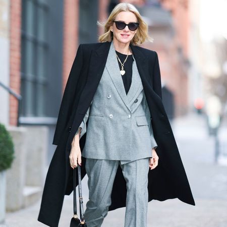 Naomi Watts wearing grey suit