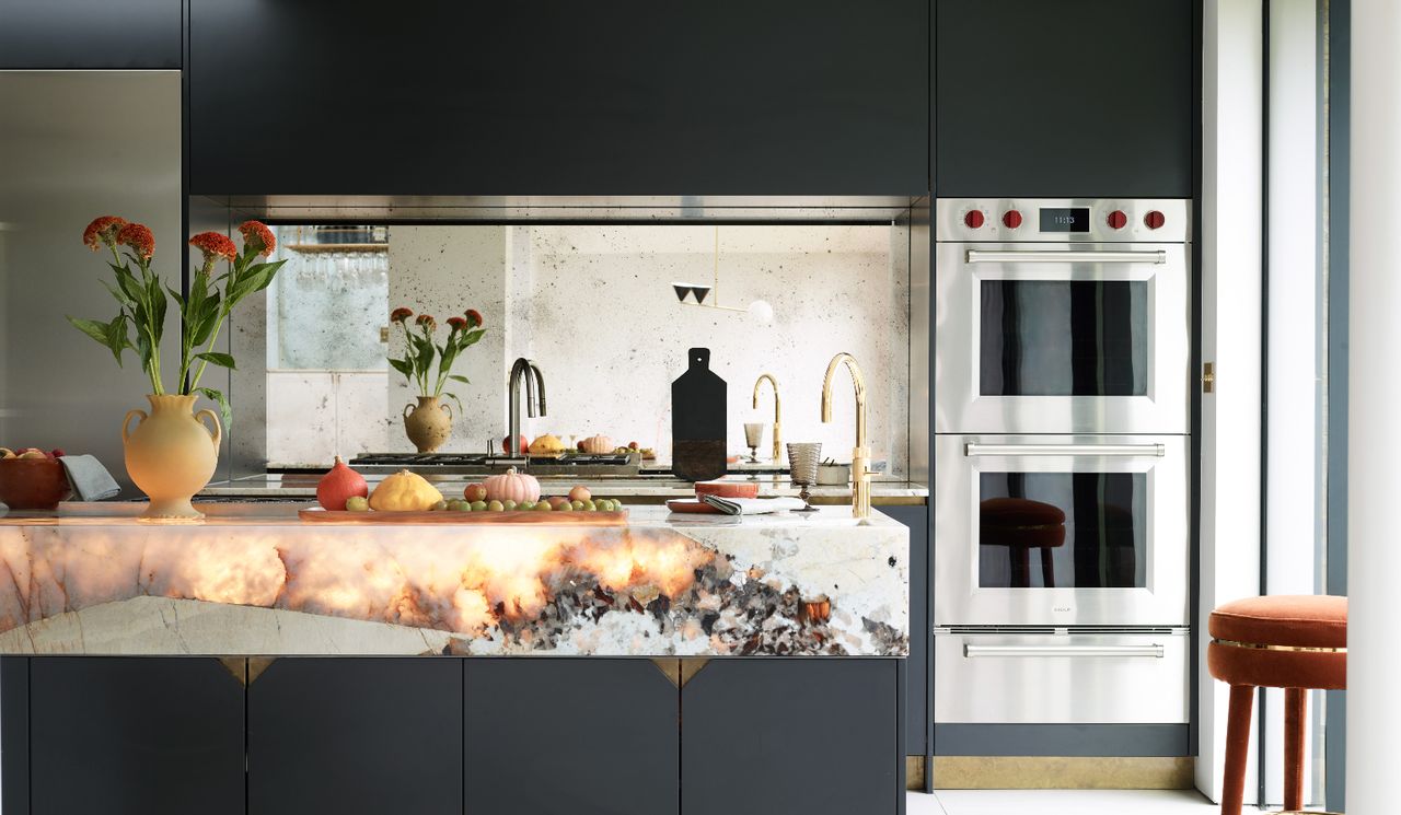 Glowing countertops in navy and white kitchen