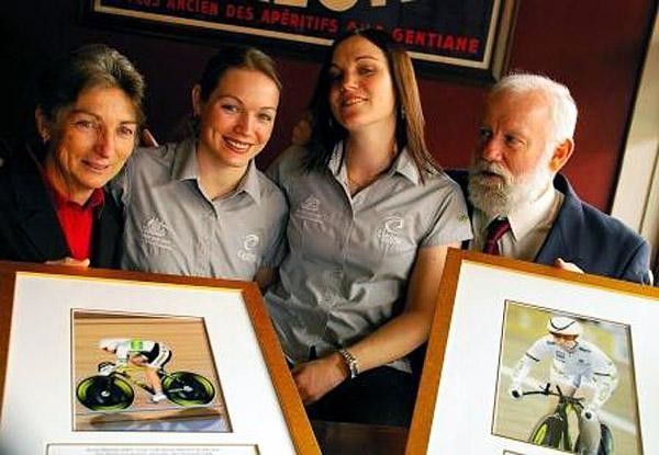 The Meares family pose with portraits of Anna riding