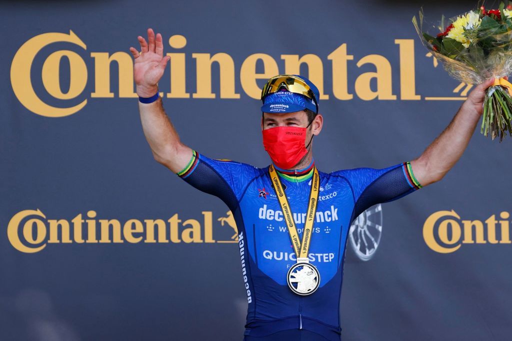 Stage winner Team Deceuninck Quicksteps Mark Cavendish of Great Britain celebrates on the podium after winning the 13th stage of the 108th edition of the Tour de France cycling race 219 km between Nimes and Carcassonne on July 9 2021 Photo by Thomas SAMSON AFP Photo by THOMAS SAMSONAFP via Getty Images