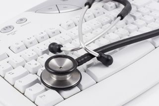 Stethoscope on a computer keyboard