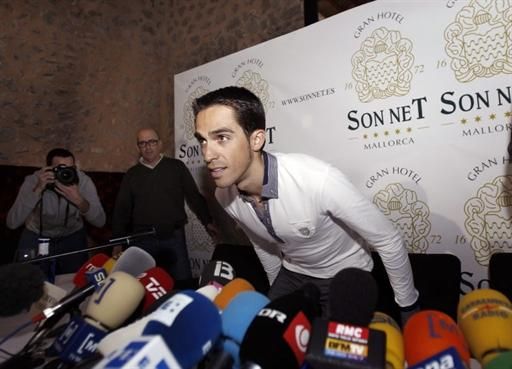 Alberto Contador takes a seat at his press conference.