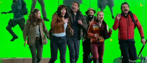 The cast of The Bubble running in panic, in front of a green screen.