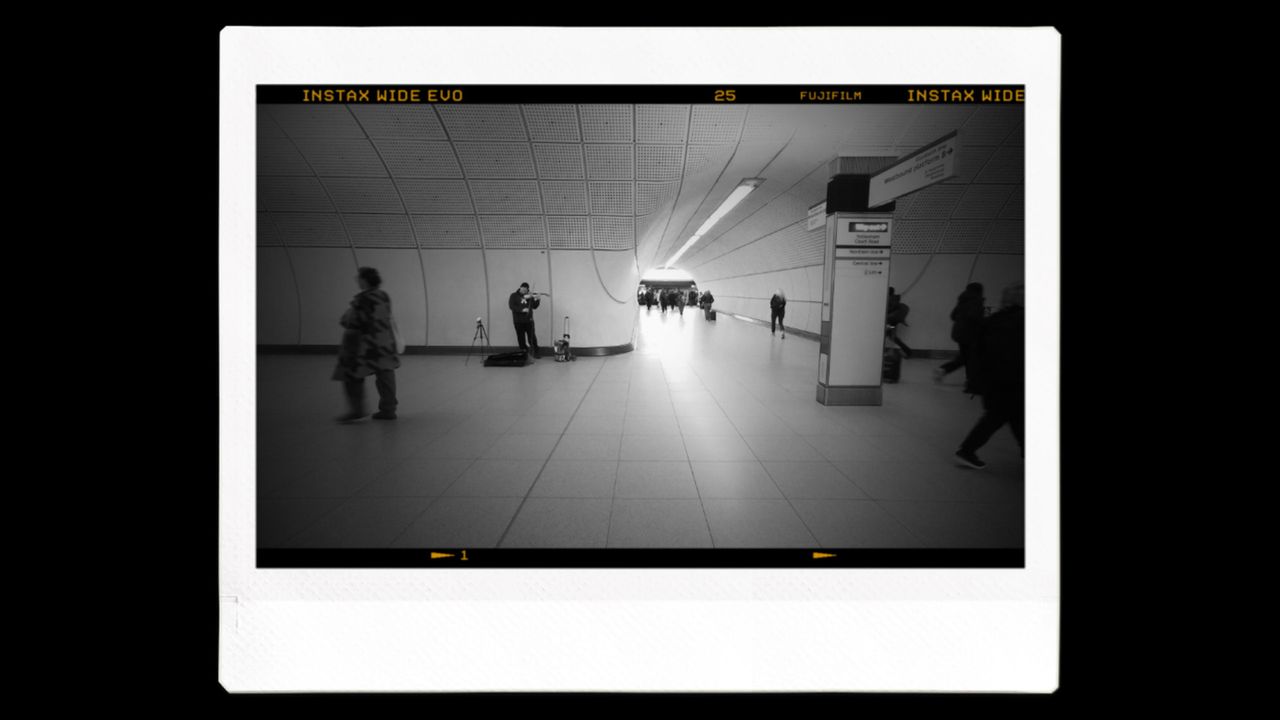 An Instax image printout of an underground station in black and white