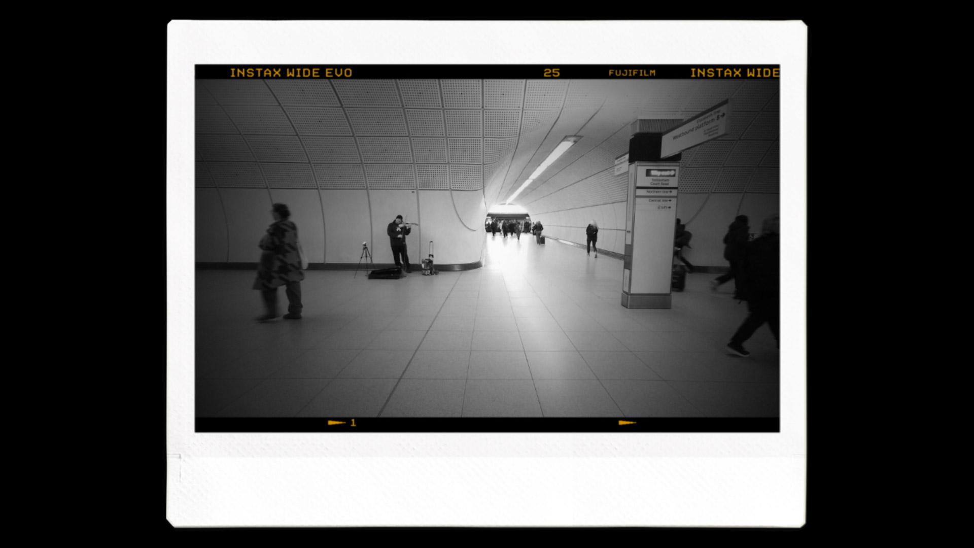 An Instax image printout of an underground station in black and white 