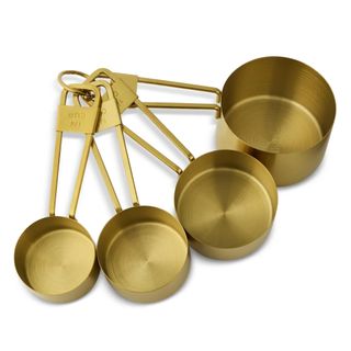 A set of gold metal measuring cups