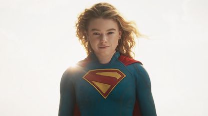 Kara Zor-El smiling with the sun behind her while she wears her Supergirl outfit