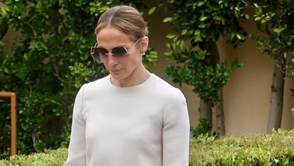 Jennifer Lopez wears a white shift dress with oversize sunglasses and a birkin bag while attending sam affleck's graduation