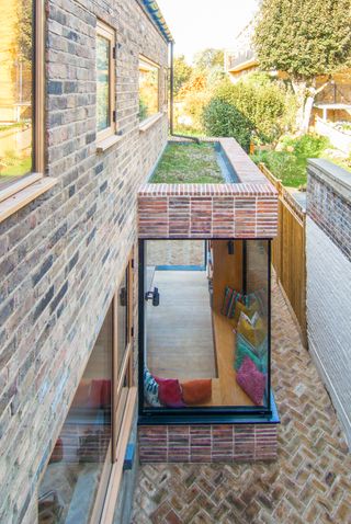 slim red brick slips on exterior of extension