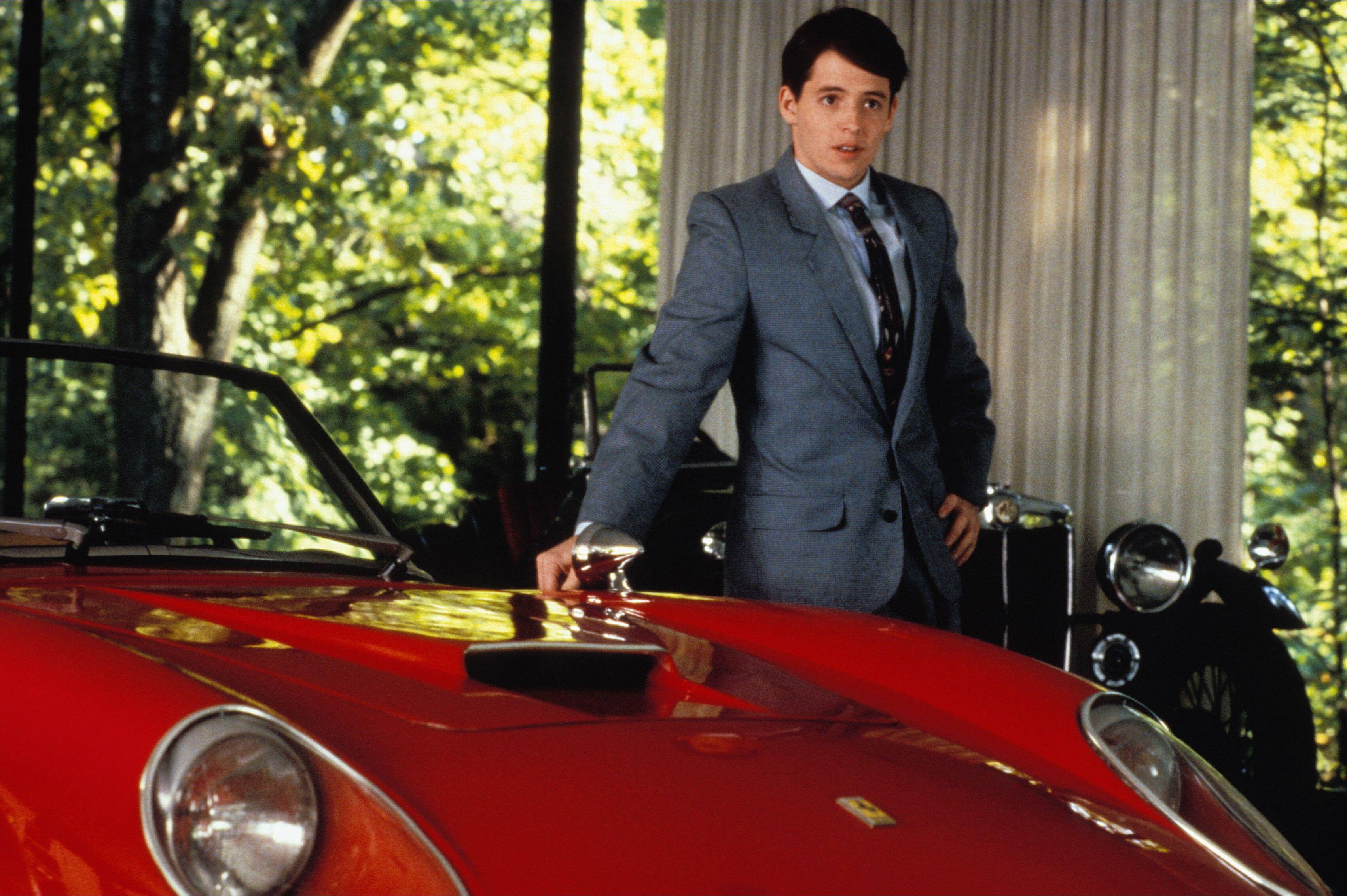 Man with red Ferrari